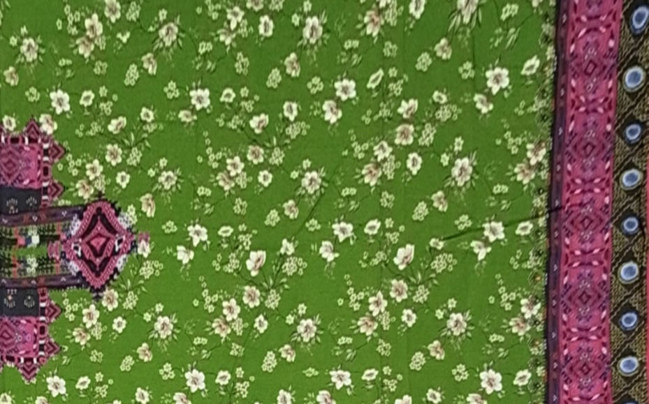 Green fabric with white floral pattern and pink border